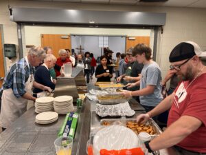 Volunteers prep meals for hundreds.