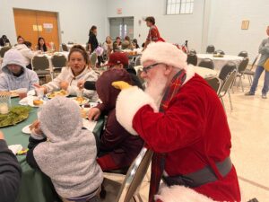 Santa speaks to children at 3 Kings Feast