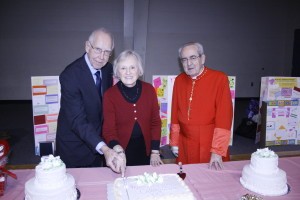 Ron and Shirley Bugos of Our Lady of Fatima Church in Alcoa cut the cake following Mass celebrating the sacrament of marriage at St. Mary Church in Oak Ridge. Cardinal Justin Rigali, shown with the Bugoses, celebrated the Mass. Photo by Dan McWilliams