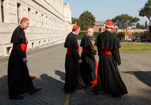 U.S. cardinals, inlcuding His Eminence Justin Rigali (third from left), leave the Pontifical North American College in Rome on their way to a final meeting with Pope Benedict XVI Feb. 28. The meeting took place just hours before the pope was to officially conclude his papacy. CNS photo/Gregory L. Tracy, The Pilot