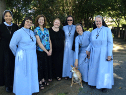 WELCOME TO RELIGIOUS LIFE Jenny Rittgers, standing fourth, is surrounded by Religious Sisters of Mercy, from right, Sisters Mary Christine Cremin, Mary Sarah Macht, Sean Marie Striby, Jenny’s mother, Kathy Rittgers, and Sisters Mary Marta Abbott and Ana Thu. Also shown is Shiloh, the Sisters’ dog.  Courtesy of Notre Dame High School and the Blarney Stone