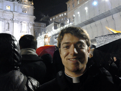 CAPTURING THE MOMENT Diocese of Knoxville seminarian Michael Hendershott is shown in St. Peter’s Square on March 13 as white smoke ascends from the Sistine Chapel in the background, signaling the election of Pope Francis. Courtesy of Michael Hendershott