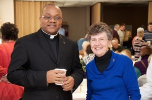Sister Mary Yvette Gillen, RSM, is shown with the pastor of St. Therese Church, Father Julius Abuh, at a recent reception reception for her.