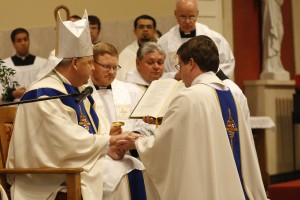 Bishop Richard F. Stika is shown with Father Christopher Manning during Father Manning's ordination Mass June 1 at Sacred Heart Cathedral. Photo by Dan McWilliams 