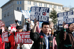 DEFENDING MARRIAGE People demonstrate outside the Supreme Court in Washington in March, when the court heard oral arguments in two same-sex marriage cases. Catholic News Service