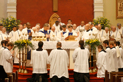 CELEBRATING THE PRIESTHOOD Bishop Richard F. Stika and priests from across the diocese celebrate at the altar with Father Christopher Manning during the ordination Mass for Father Manning on June 1 at Sacred Heart Cathedral. Father Manning became the 41st priest ordained in the Diocese of Knoxville. Photo by Dan McWilliams