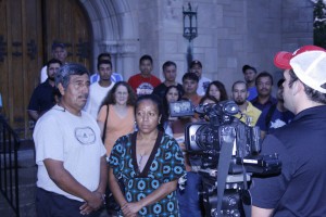 Diocese of Knoxville parishioners are interviewed by a WBIR-TV, Channel 10 photojournalist at Holy Ghost Church Aug. 23 following an immigration reform vigil. Photo by Bill Brewer