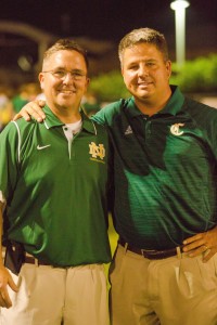 Brothers Howie Sompayrac, left, Notre Dame High School's athletics director, and Dickie Sompayrac, Knoxville Catholic High School principal, are shown during the Irish Bowl football game at KCHS Aug. 23. Photos by Stephanie Richer