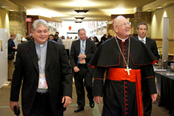 LOGISTICAL LEADERSHIP Deacon Sean Smith escorts Cardinal Timothy Dolan inside the Sevierville Convention Center during the Eucharistic Congress on Sept. 14. Photo by Scott Maentz