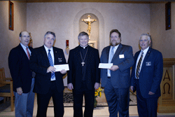 Checks in hand Making the presentation of checks to Bishop Richard F. Stika are Knights of Columbus representatives (from left) Mike Wills, Hank McCormick, Tracy Staller, and Ron Henry. The checks were presented Nov. 1 in the Our Lady of the Mountains Chapel at the Chancery office in Knoxville and will benefit seminarian education and other diocesan programs. Photo by Dan McWilliams