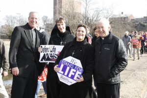 Father John Dowling of St. Francis of Assisi Parish in Fairfield Glade and Father Michael Woods of All Saints Parish are joined by Sister Stella Maris, RSM, and Sister Mary Marta Abbott, RSM, on the March for Life in Knoxville Jan. 26. Photo by Bill Brewer