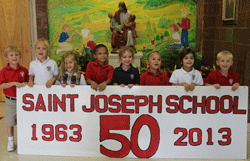 GETTING THE MESSAGE OUT  St. Joseph School kindergartners display a banner earlier this school year promoting the school’s 50th year. St. Joseph has announced plans to build an addition to the North Knoxville school. Courtesy of St. Joseph School