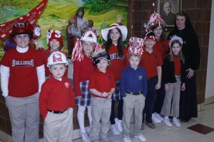 St. Joseph School students and faculty show off their winning hats from a Catholic Schools Week competition. Photo by Bill Brewer