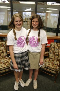St. John Neumann School classmates Maddie Vanderhoofven, left, and Mary Iverson, who are seventh-graders, inspired each other to donate their hair. Photo by Bill Brewer
