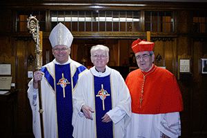 WELL DONE, GOOD AND FAITHFUL SERVANT Bishop Richard F. Stika, left, Monsignor George Schmidt, center, and Cardinal Justin Rigali are shown at the Basilica of Sts. Peter and Paul after a Mass for Monsignor Schmidt, who has retired after serving at the basilica for 28 years. Photo by Dan McWilliams