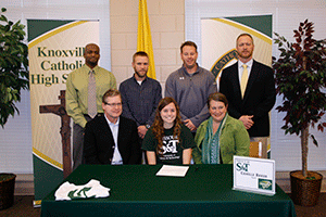 STATE CHAMPION Camille Baker is pictured at her recent signing with the Missouri University of Science and Technology. Also seen are her parents, James and Lori Baker, and hurdles coach Brandon Harris, distance coach Sean O’Neil, jumps coach David Ball, and KCHS athletics director Jason Surlas. Photo by Dan McWilliams