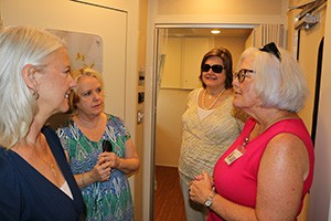 Clinic RN Gloria Risko (right) leads a tour of the clinic for (from left) nurse Kim Carter, Marian Christiana, and Karen Byrne. Photo by Dan McWilliams
