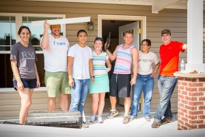 Members of the Frassati Fellowship of young adults have been helping build a house for a Knoxville family. The Diocese of Knoxville group includes, from left, Cozette Sanders, Caleb Scrobak, Alvine Manabat, Angela Strong, Elijah Martin, Mariclair Tan, and Andrew Giminaro. Photo by Stephanie Richer