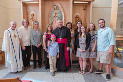 A CHAPEL’S BLESSING Bishop Richard F. Stika, center, is shown with the artists and family members of Elizabeth Siminerio, who made the Marian Chapel at All Saints Church possible. From left are Father Michael Woods, Scott DeWaard, Sabiha Mujtaba, Patti Siminerio, Caden Cheverton, Fran Siminerio, Ashley Teeters, Caitlin Siminerio,Lacey Siminerio, and Patrick Siminerio. Photo by Stephanie Richer