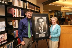 Eric Theodore, Knoxville Catholic High School Class of 2011, and Carolyn Sue (Wright) Huber, KCHS Class of 1951, show Mr. Theodore's drawing of noted author Cormac McCarthy, KCHS Class of '51, on Oct. 18 at the high school. Photo by Bill Brewer