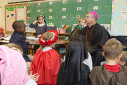 TALKING ABOUT SAINTS Bishop Richard F. Stika visits with a class at St. Joseph School on Nov. 3 to mark All Saints Day. Photo by Stephanie Richer