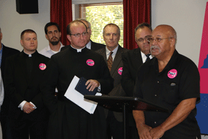 BROAD BASE OF SUPPORT Father John Orr, center, associate pastor of Holy Ghost Parish, is joined by Father Adam Kane, left, associate pastor of Sacred Heart Cathedral, and several other pastors in the Knoxville area during a press conference on Oct. 23 to voice support for Amendment 1. Photo by Dan McWilliams