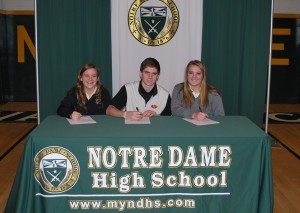 MOVING TO THE NEXT LEVEL Courtney Boyd (left), Zac Bombassi, and Taylor Green signed with colleges Dec. 10 at Notre Dame.  Courtesy of Gayle Schoenborn