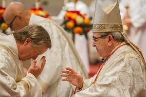 Cardinal Justin Rigali gives Deacon David Lucheon a blessing during Mass on April 19 at Sacred Heart Cathedral. Photo by Stephanie Richer