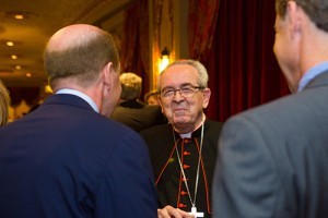 Cardinal Justin Rigali is engaged in conversation at a reception on April 18 at the Tennessee Theatre. Photo by Stephanie Richer