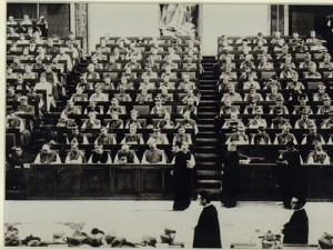 Cardinal Justin Rigali, standing in front of center section, serves as a priest assistant at the Second Vatican Council.
